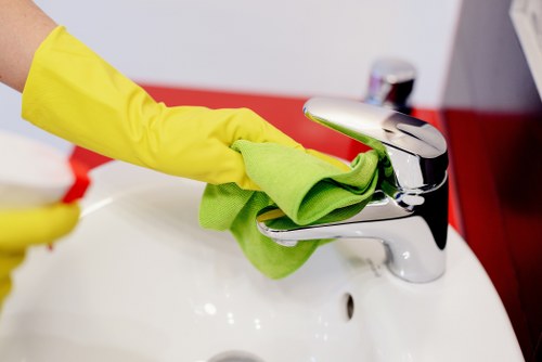 Team member managing carpet cleaning equipment and keeping a work area hazard-free