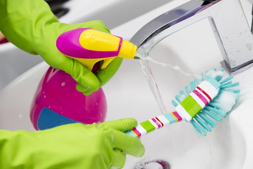 Cleaner inspecting fabric and stain conditions before treatment