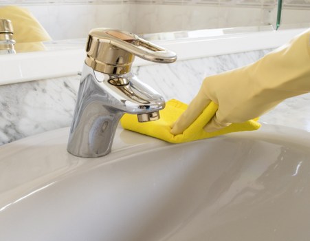 Professional carpet cleaning team working with safety precautions